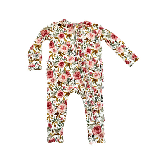 Dusty pink floral bamboo ruffle baby outfit with 2-way zipper, fold-over feet and hand cuffs for babies.