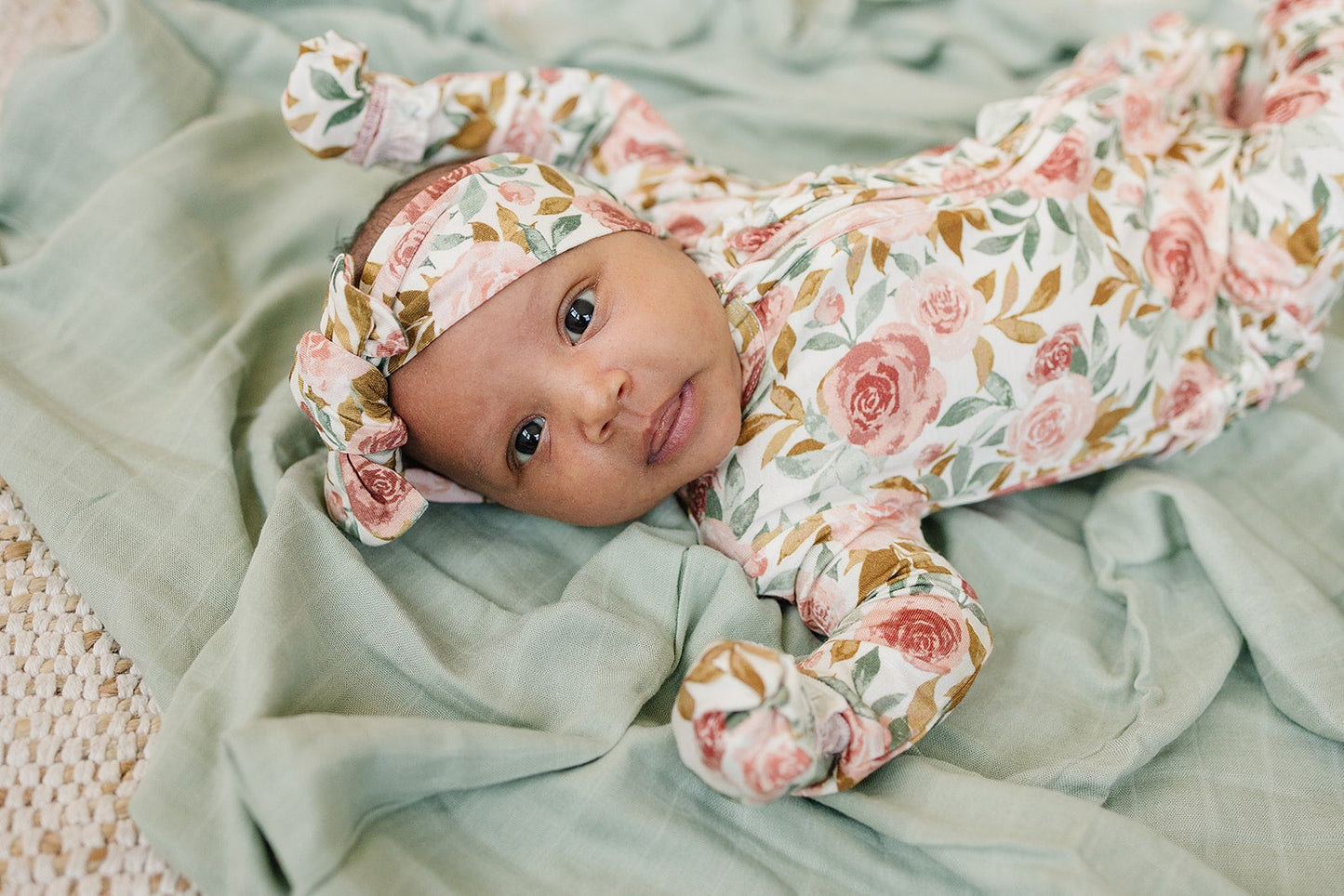 Dusty pink floral bamboo knotted baby gown with fold-over cuffs